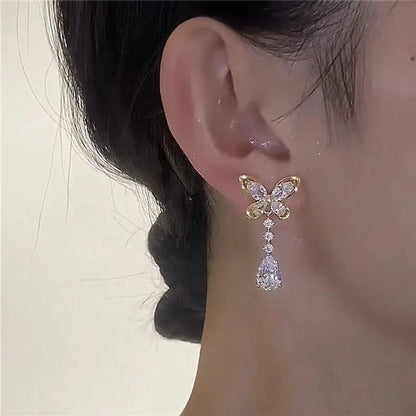 Bow stud earrings with platinum electroplated finish on zinc alloy