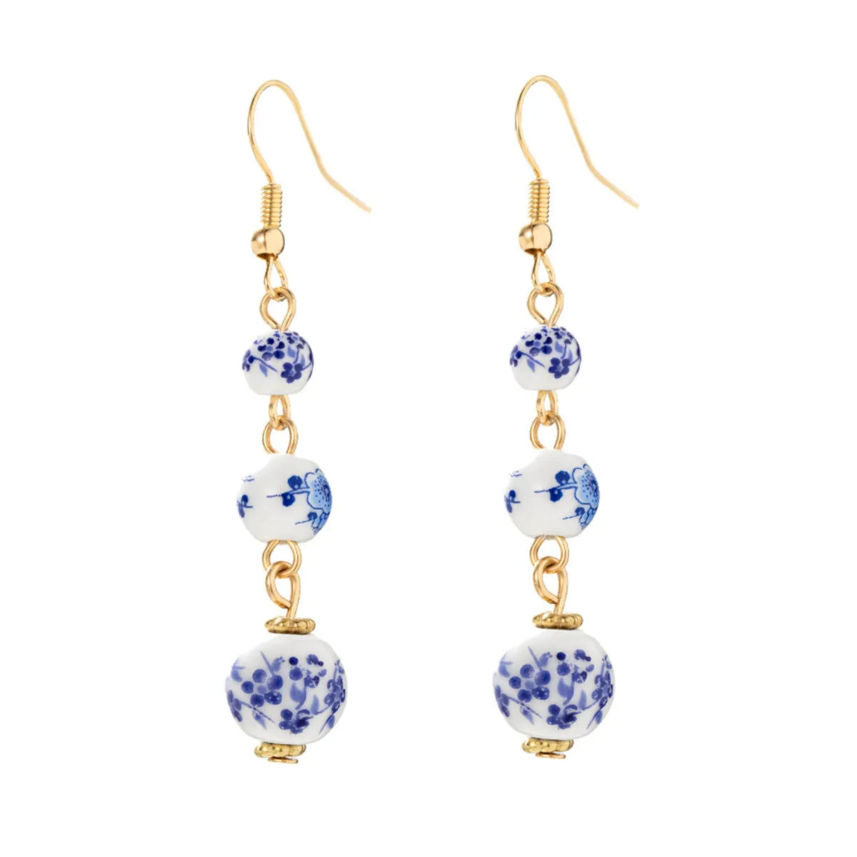 Long retro earrings with blue and white porcelain ceramic beads and geometric alloy construction