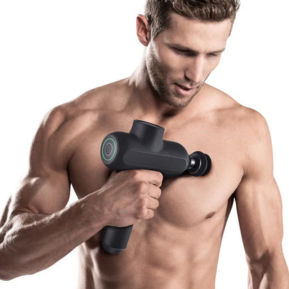 Black cordless electric muscle massager with six different coloured attachment heads on a white background.