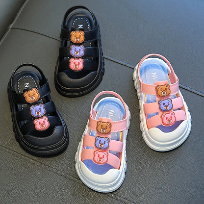 Boy's cartoon pattern baby shoes with non-slip PVC soles and Velcro fastening in black colour