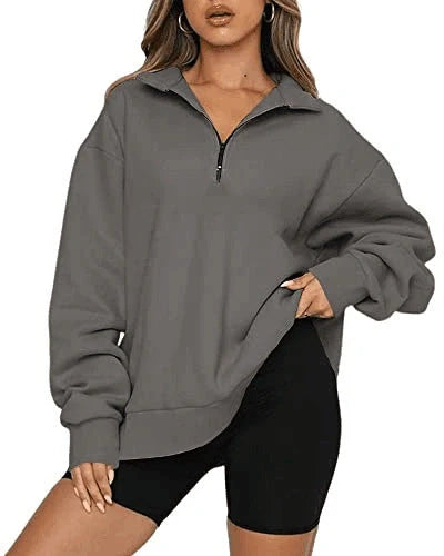 Women's zip turndown collar sweatshirt in various colors, showcasing loose fit and zipper detail.