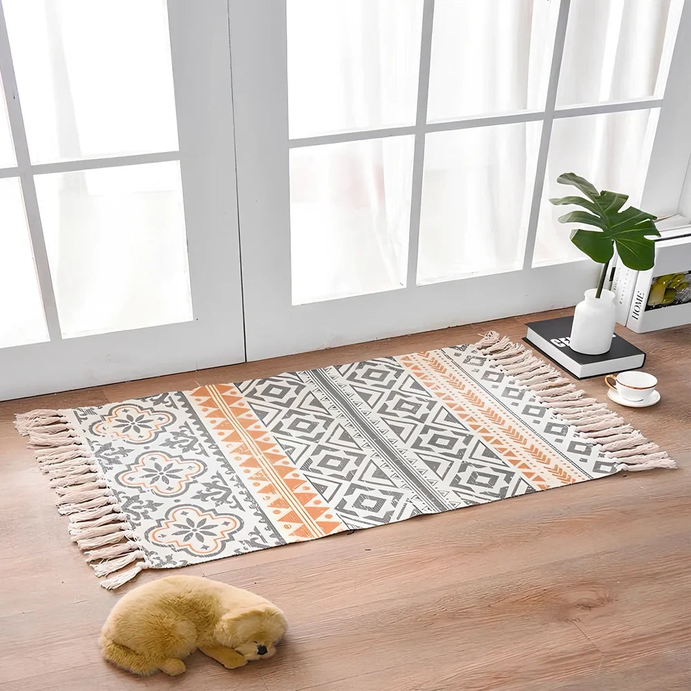 Hand-woven Scandinavian style linen cotton rug with woven tassels in plant-dyed colours measuring 60x90cm
