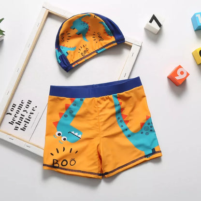 Cartoon dinosaur swimming trunks for boys in light blue, dark blue, and orange