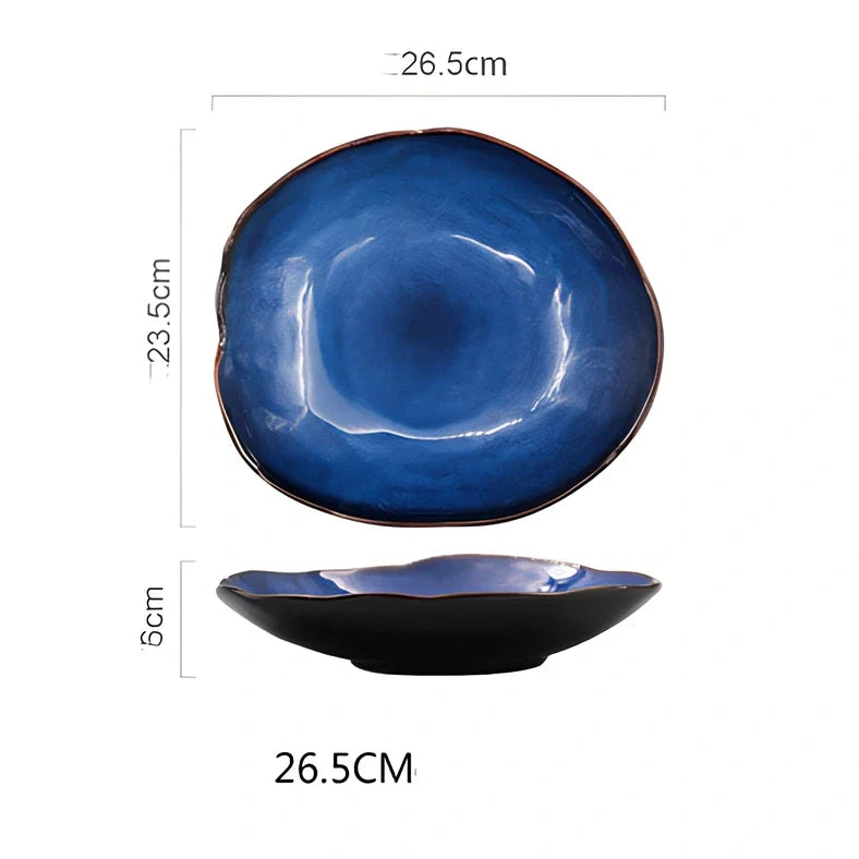 Blue irregular ceramic plate with kiln-changing glaze pattern, measuring approximately 20cm across irregular edges