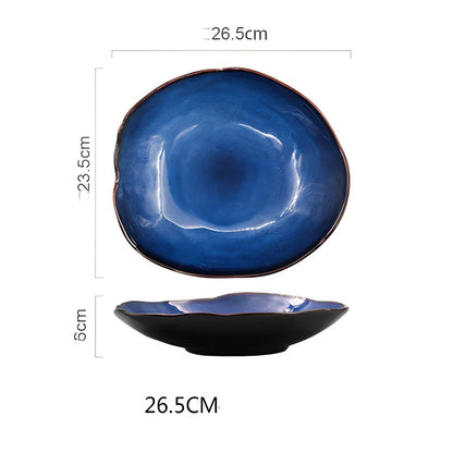 Blue irregular ceramic plate with kiln-changing glaze pattern, measuring approximately 20cm across irregular edges