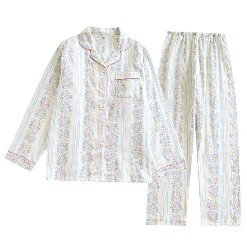 Red fruit print cotton gauze ladies' pyjama set with long sleeves and trousers laid flat.