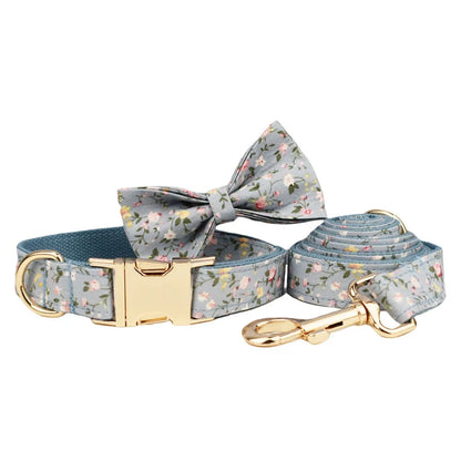Blue floral dog collar set with adjustable sizes, includes leash, vest, bow, and poop bag on polyester cotton cloth.