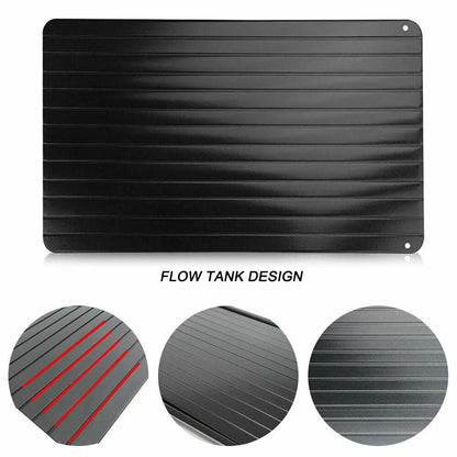 Black aluminium fast defrosting tray for thawing frozen food on kitchen counter