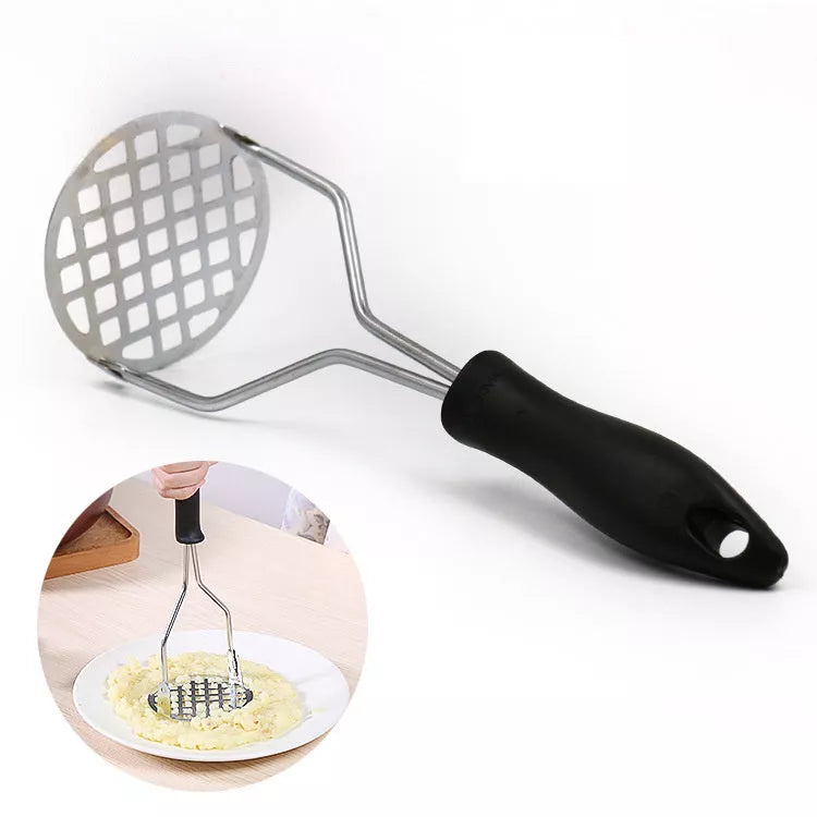 Manual potato masher with wooden handle and flower-shaped press for easy mashing