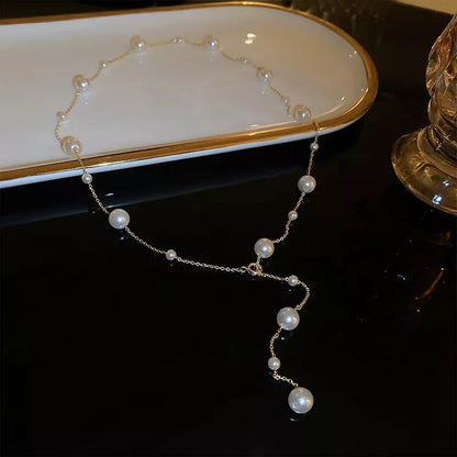Starry Pearl Choker Necklace in gold and silver options, featuring imitation pearls and electroplated finish.