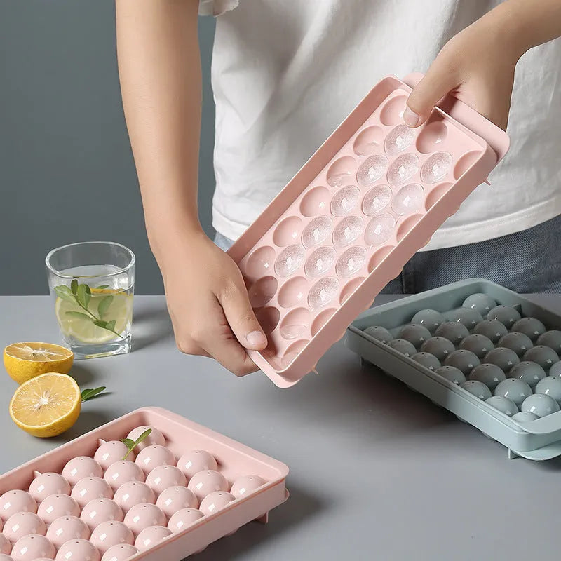 3D round ice moulds in sky blue or pink colours showing 18 and 33 grid options