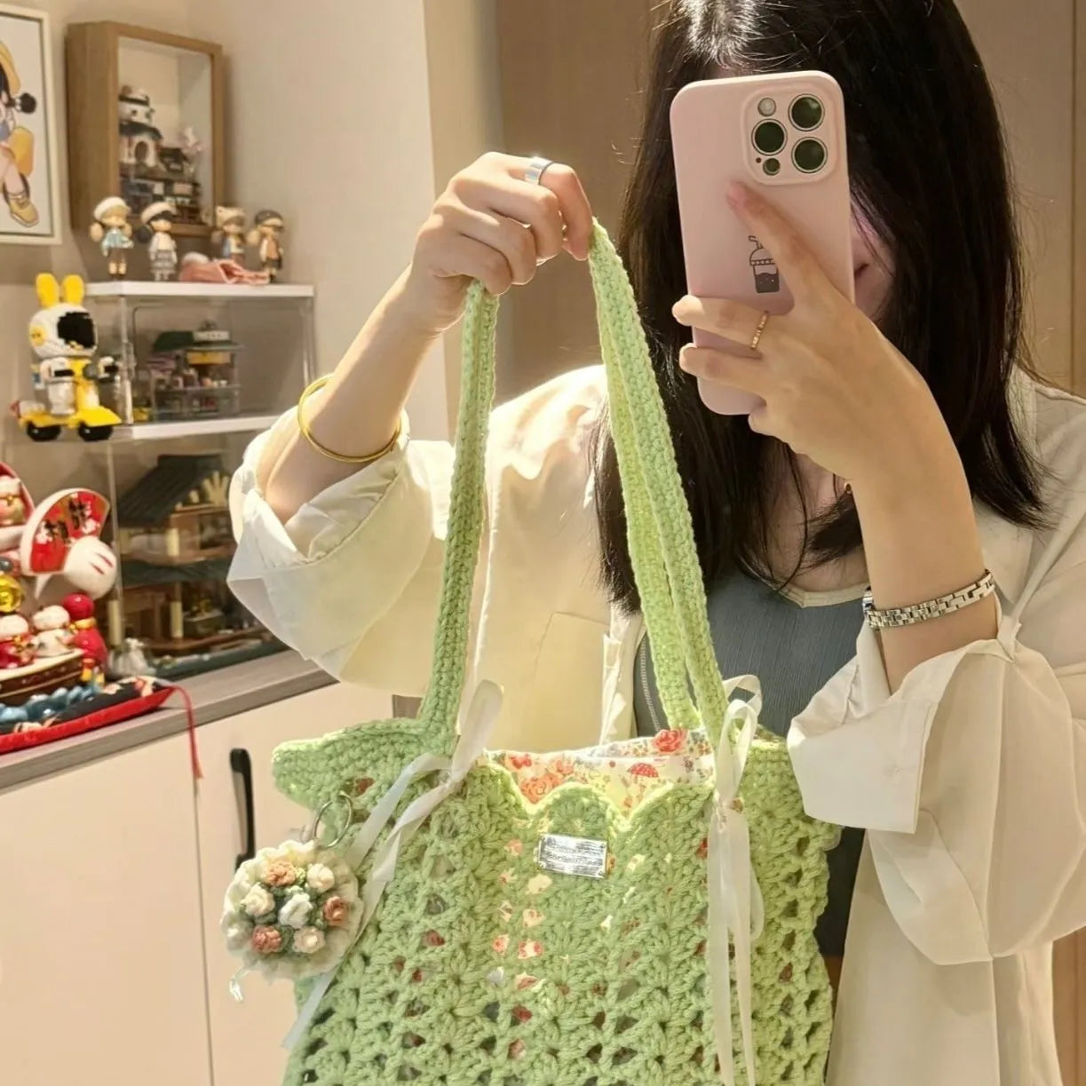 Handmade woven wool bag with floral pattern, approximately 0.5m tall