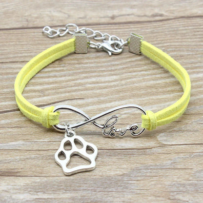 Hand-woven Infinite Love Pet Bracelet in various colors, showcasing the bow shape and alloy material.