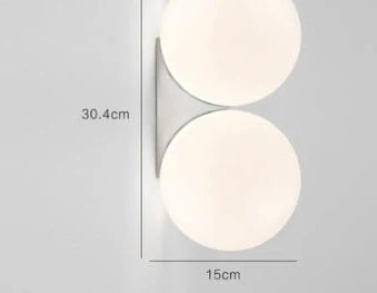 Nordic minimalist wall lamp with adjustable double heads in black finish mounted on white wall