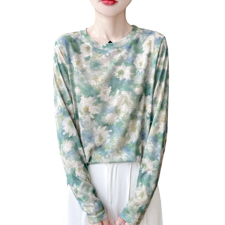 Round neck floral print pullover shirt in Tencel cotton blend fabric on hanger