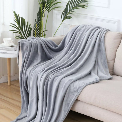 Solid color flannel blanket in various sizes and colors, made from durable polyester fiber