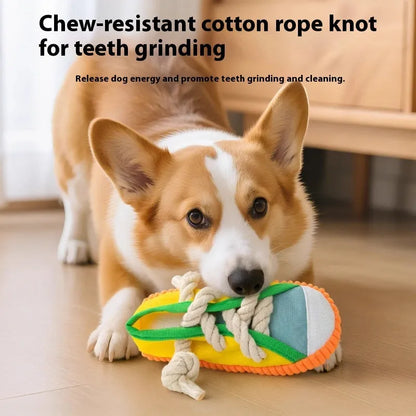 Durable plastic dog chew toy in slipper shape with bends, in yellow, black, or blue.