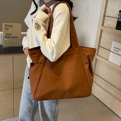 Soft Oxford cloth foldable commuter tote bag in street style, shown in multiple colour options.