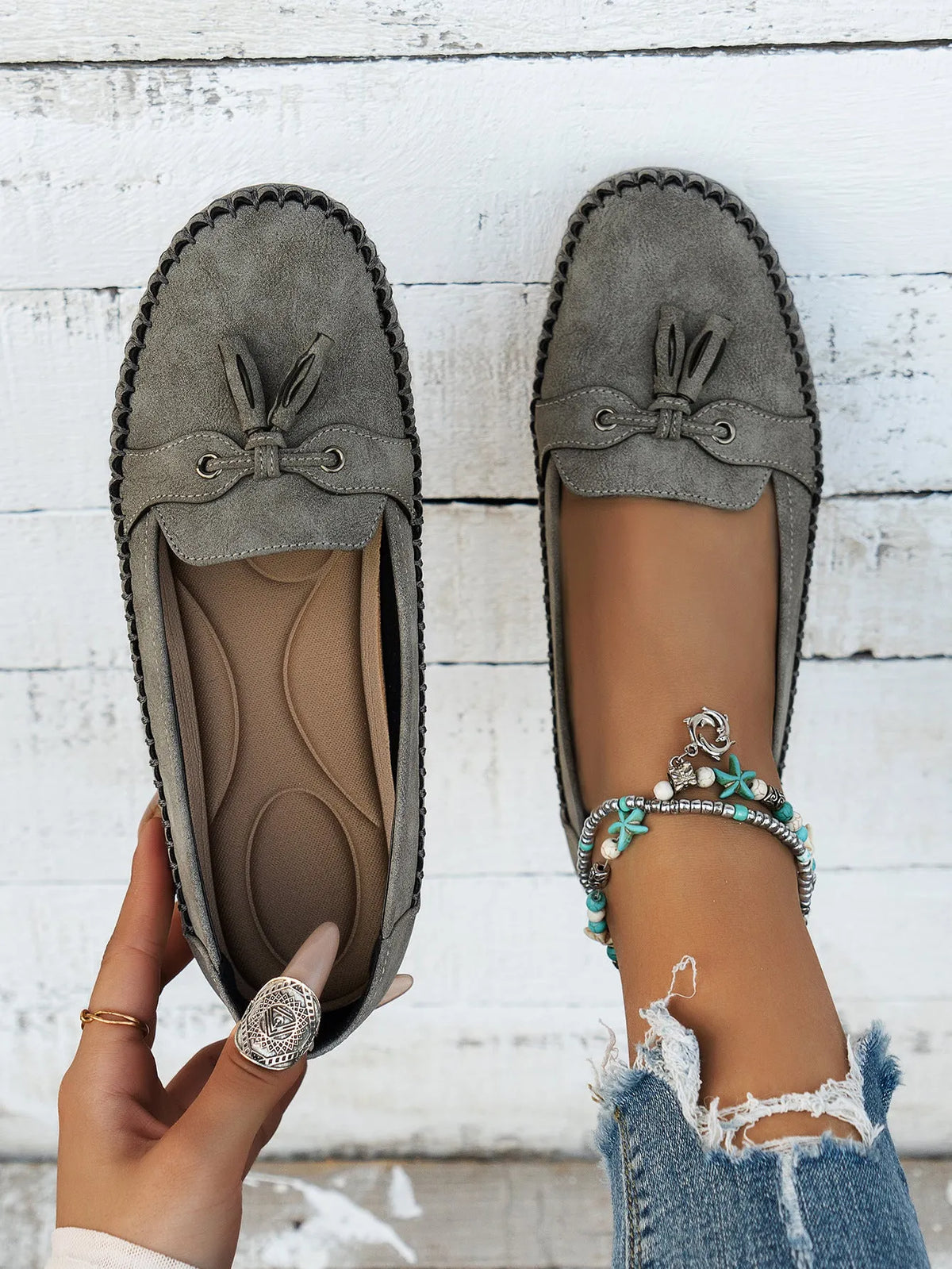 Women's casual suede flat shoes with decorative bow and round toe in apricot colour