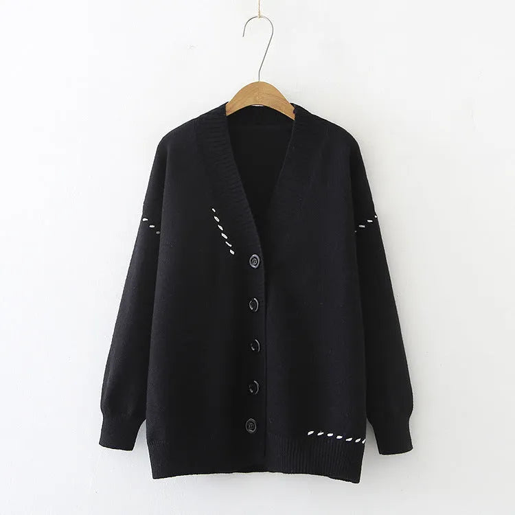 Women's knitted cardigan top coat in black or white, loose fit with long sleeves, made from 100% polyester