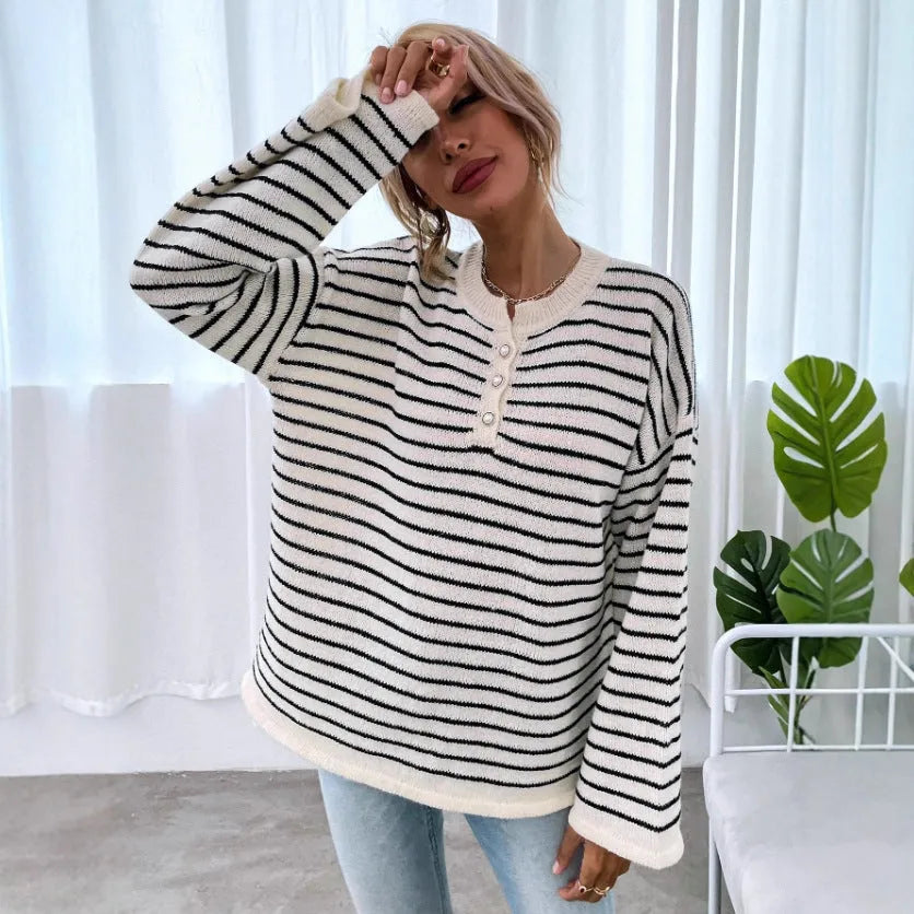 Women's black and white striped loose top with drop shoulders and button detail