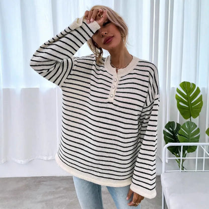 Women's black and white striped loose top with drop shoulders and button detail