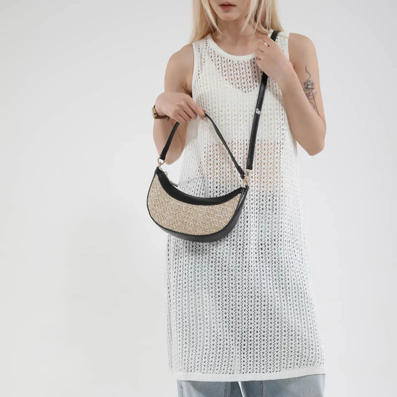 Women's hard-shell straw shoulder bag in a dumpling shape with a crossbody strap, shown in a choice of colours.