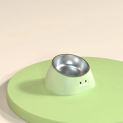 Green tilted stainless steel pet bowl with a 15-degree angle on a white background.