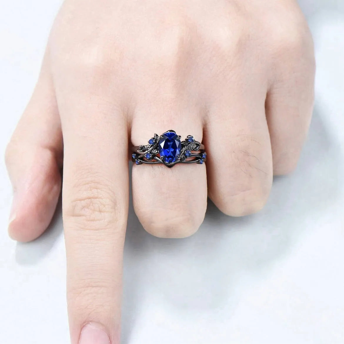 Geometric gun black couple ring with navy blue rhinestones on copper base