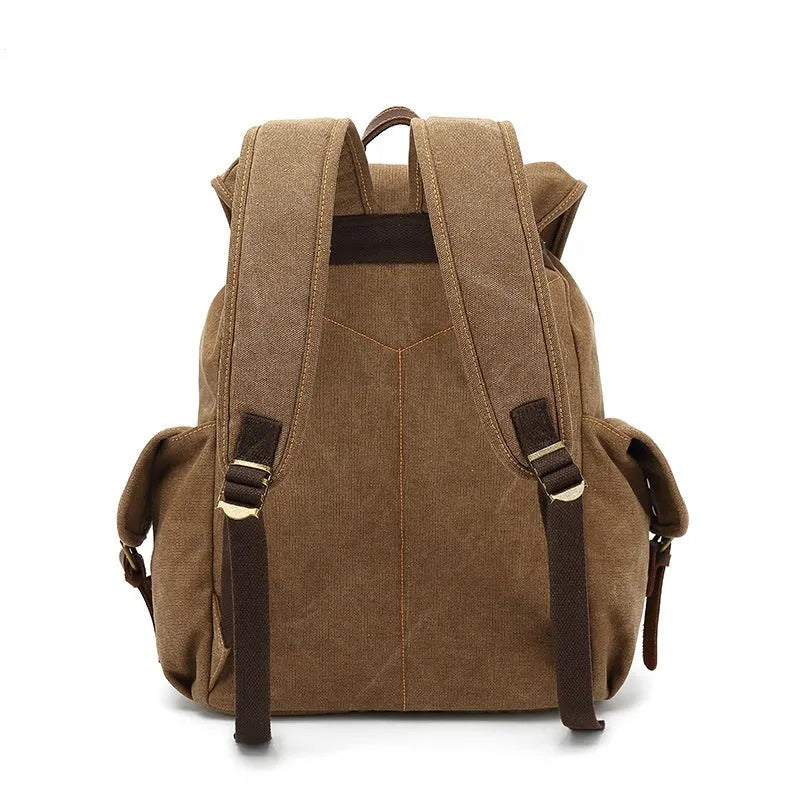 Retro canvas backpack in army green with antique bronze hardware, showing front compartments and size.