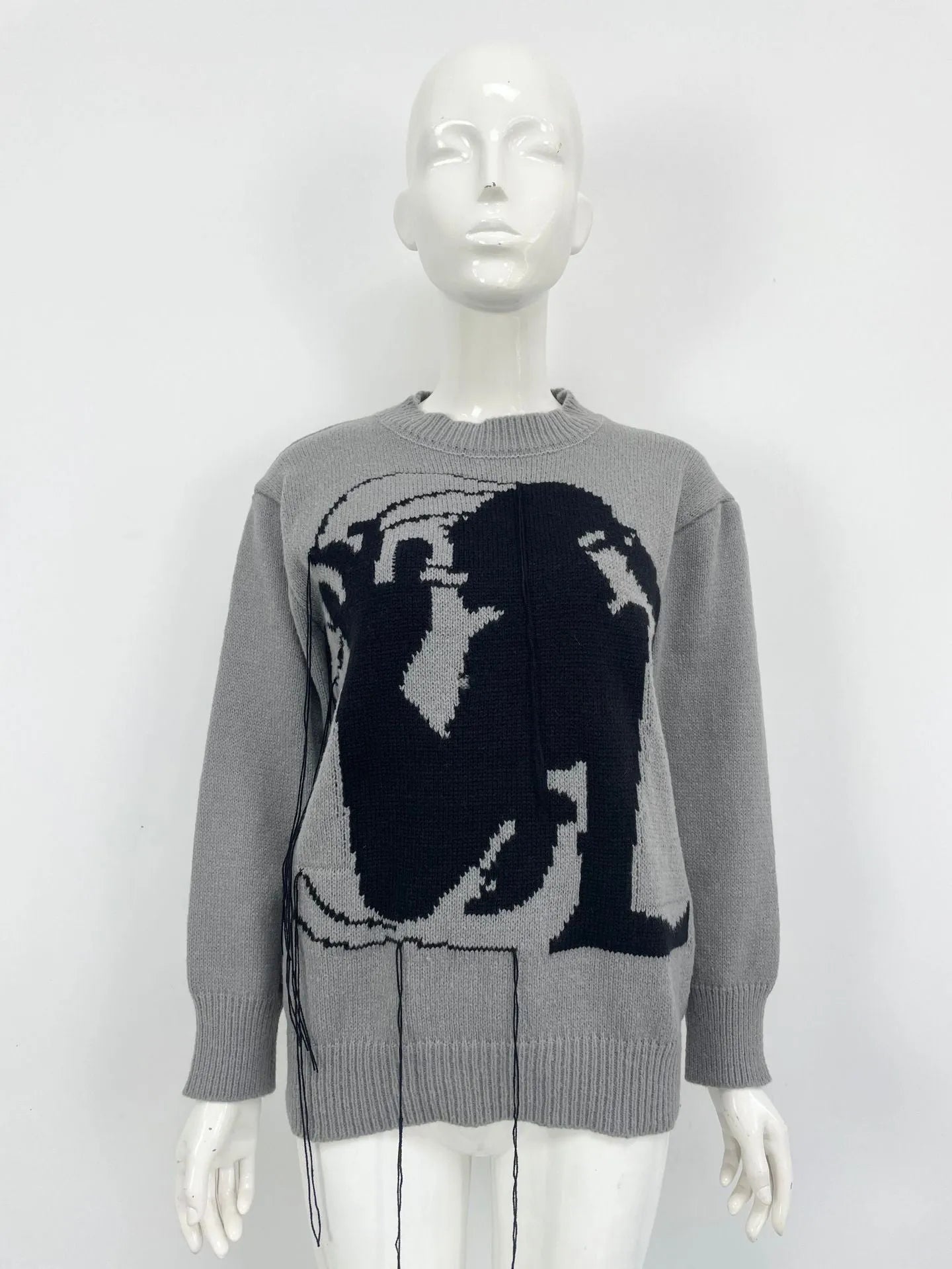 Women's grey alpaca wool sweater with abstract pattern and tassel design on regular sleeves