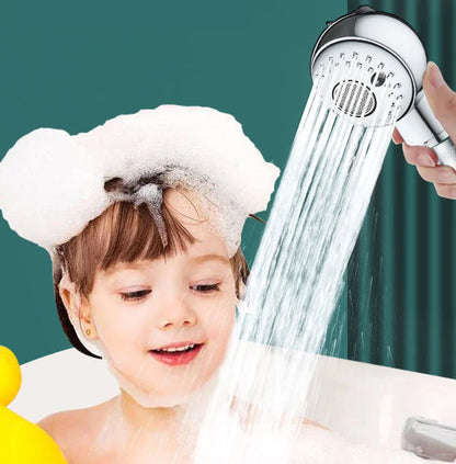 Small silver handheld shower head for gentle washing of pets and babies.