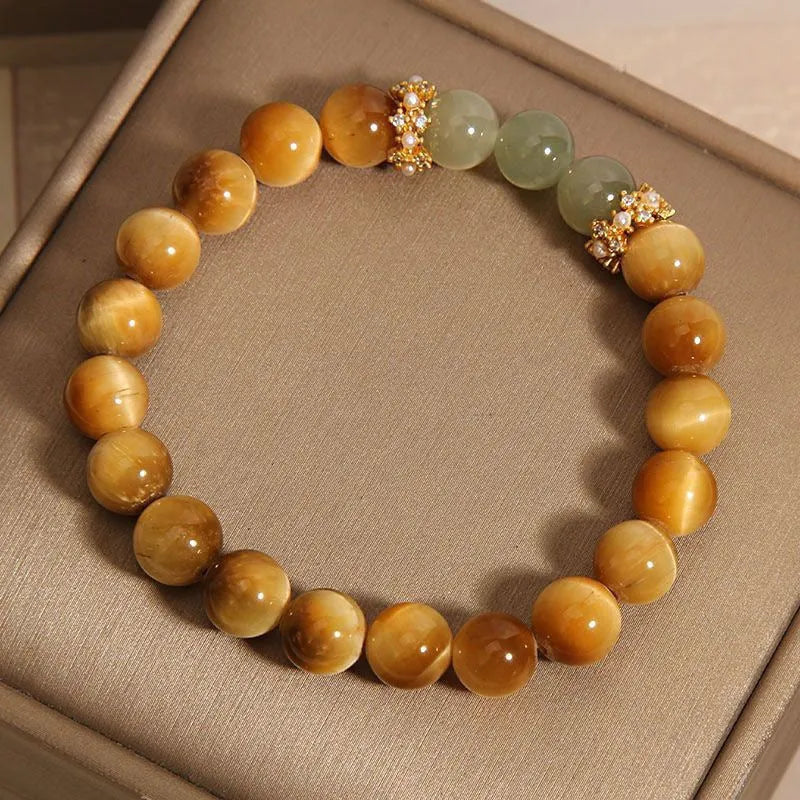 Natural yellow Tiger's Eye bracelet with Hetian jade elements and gold gourd charm on wrist