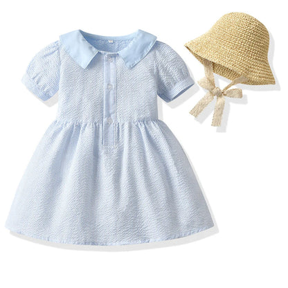 Girl wearing yellow plaid princess cotton dress with matching lace straw hat summer set