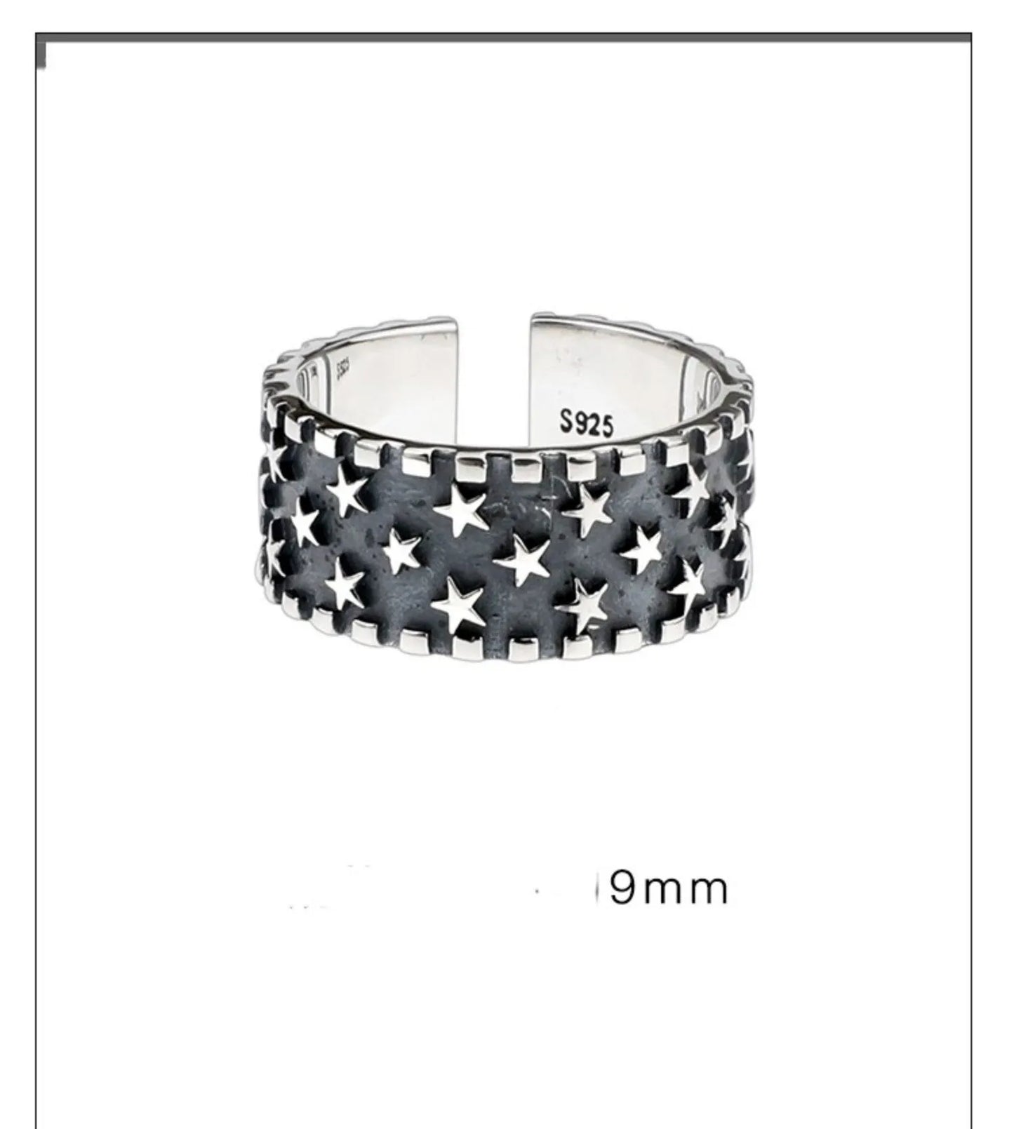 Close-up of a polished sterling silver ring with a raised five-pointed star pattern on an adjustable band.