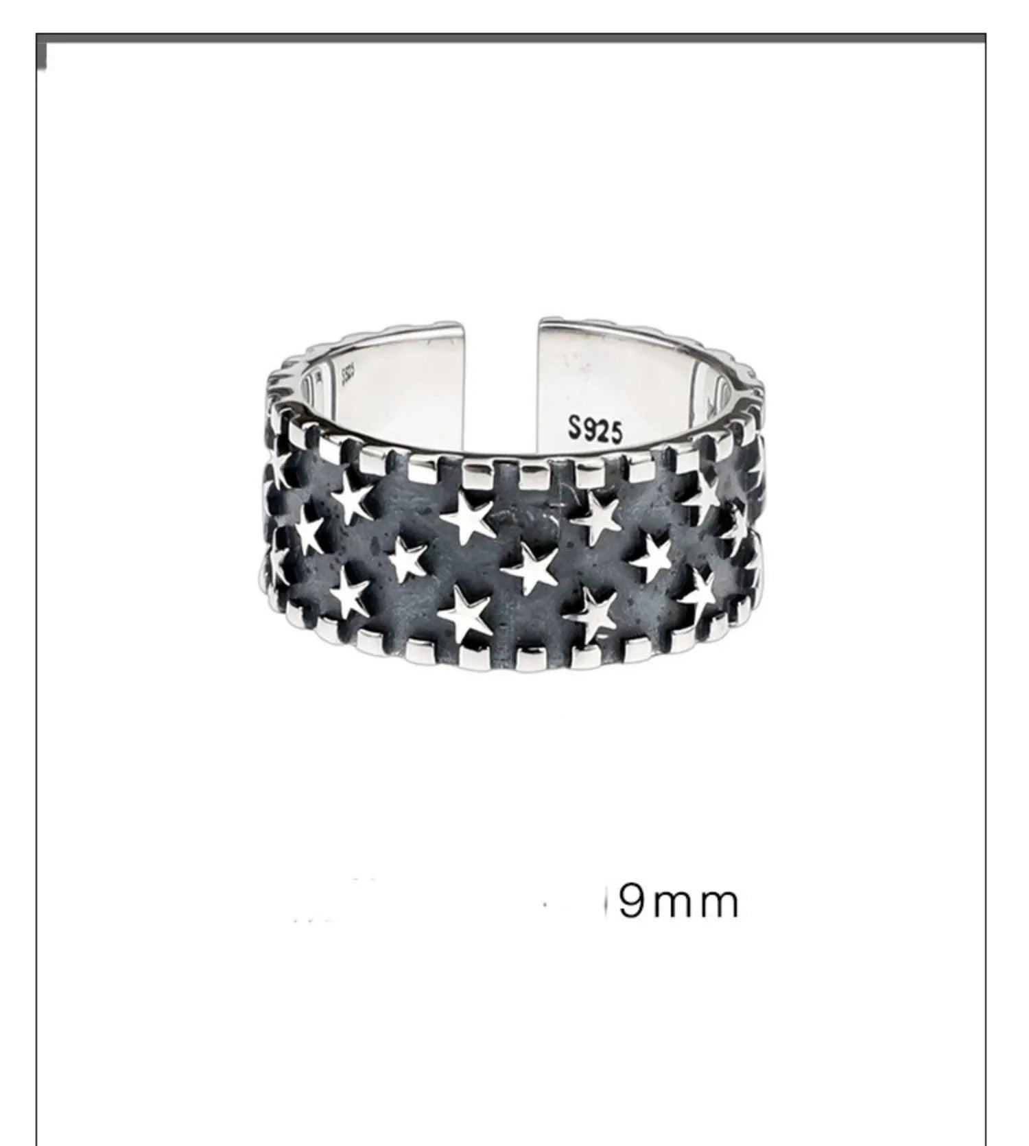 Close-up of a polished sterling silver ring with a raised five-pointed star pattern on an adjustable band.