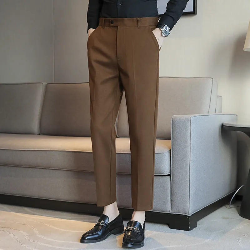 Straight-leg brown corduroy trousers with elastic waistband and slim fit design