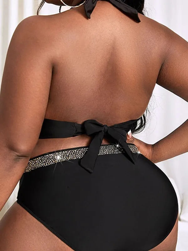Black plus size women's bikini set on a mannequin, showing the bra and shorts.