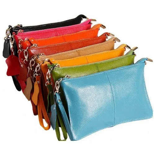 Lady's cowhide slant bag in apricot colour showing front view with strap and compact 24 cm size.