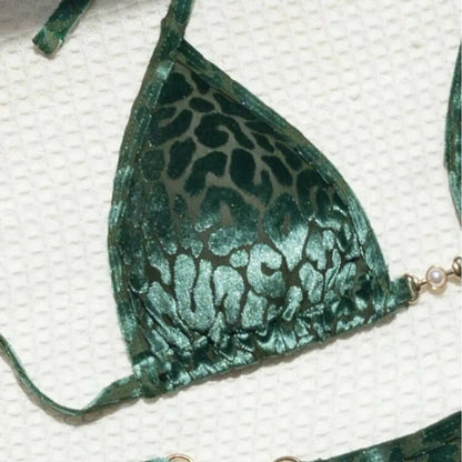 Women's blue leopard print T-shaped bikini set for swimming on a mannequin.