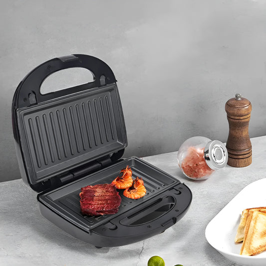 Black double-sided heating electric sandwich pan with brushed stainless steel top cover and non-stick coating.