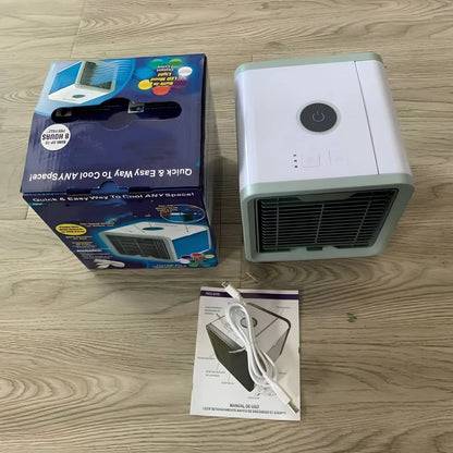 Desktop air conditioner fan with USB cable and water tank showing 7-colour LED lighting and mechanical control dial
