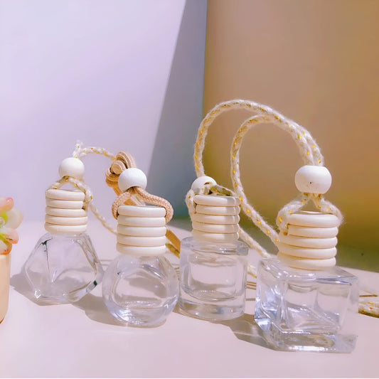 Car perfume pendant in four glass bottle styles: cylinder, diamond, flat drum, and square
