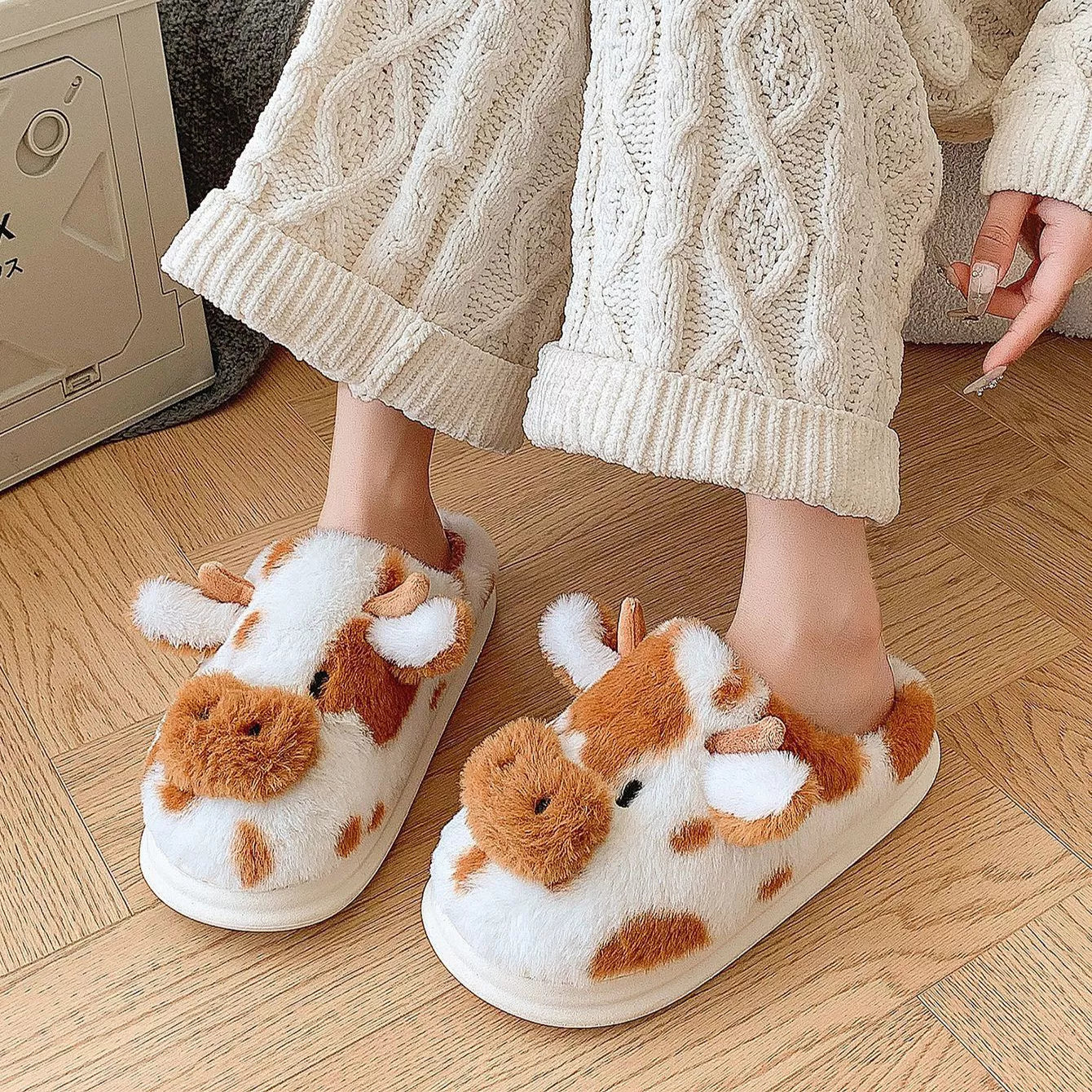 Cartoon cow plush slippers in black, leather red, and brown with non-slip soles