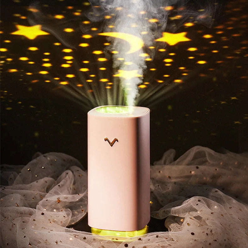 Blue aromatherapy projection humidifier measuring 7.5cm square with water tank and control buttons