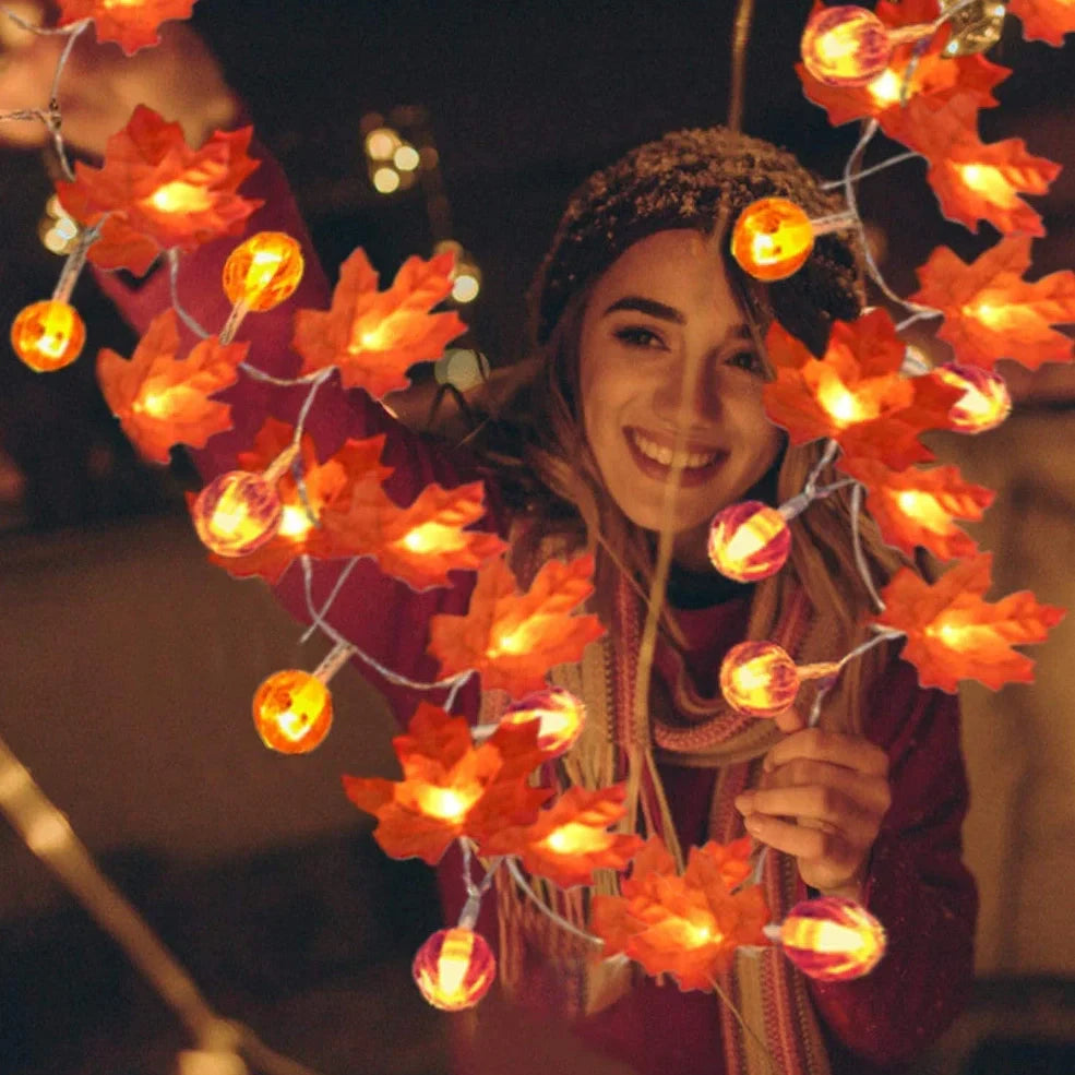 Halloween pumpkin light string with orange plastic pumpkins and warm white LED illumination