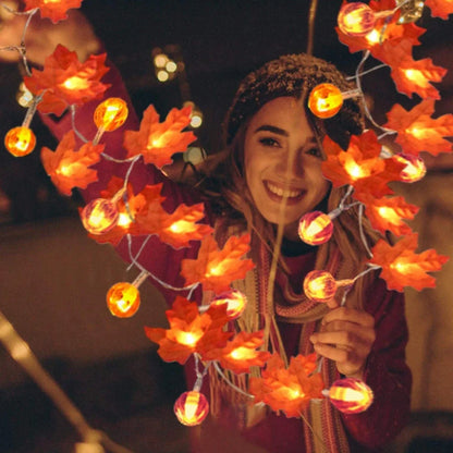 Halloween pumpkin light string with orange plastic pumpkins and warm white LED illumination