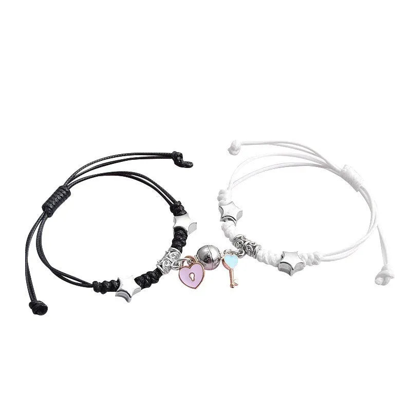 Magnetic suction couple bracelet pair in alloy with an electroplated finish, showing example designs like a crown and love lock.