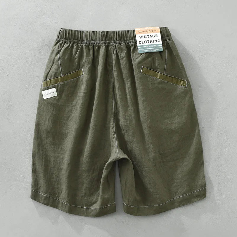 Men's solid colour linen shorts in loose straight drooping style on hanger