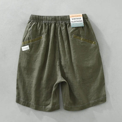 Men's solid colour linen shorts in loose straight drooping style on hanger